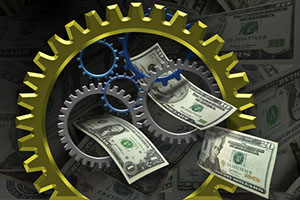 Several gears placed together with money in the background